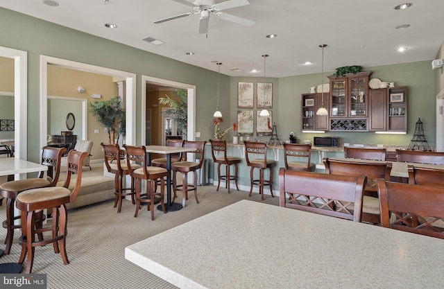 31766 Chablis Ln Unit 76, Lewes, DE 19958 - dining area with light carpet, a ceiling fan, and recessed lighting