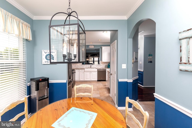 31766 Chablis Ln Unit 76, Lewes, DE 19958 - dining area with arched walkways, light tile patterned flooring, ornamental molding, and a chandelier