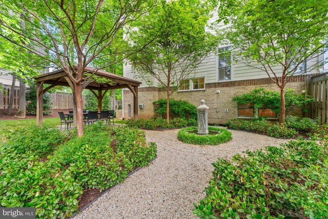 view of yard featuring a gazebo and fence