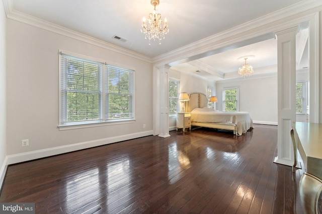 bedroom featuring a chandelier, decorative columns, dark wood-style flooring, baseboards, and crown molding