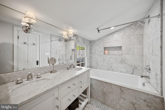 bathroom featuring lofted ceiling, double vanity, and tiled shower / bath combo