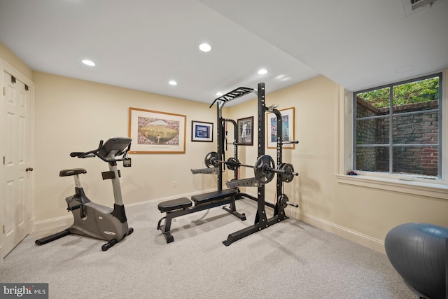 workout area with baseboards, recessed lighting, and carpet