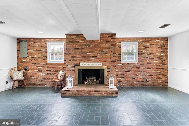 7607 Newcastle Dr, Annandale, VA 22003 - unfurnished living room with a fireplace, brick wall, and baseboards