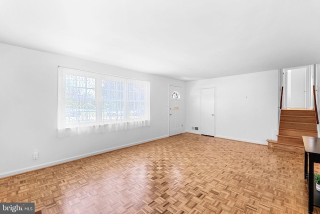 7607 Newcastle Dr, Annandale, VA 22003 - unfurnished living room with stairway and baseboards