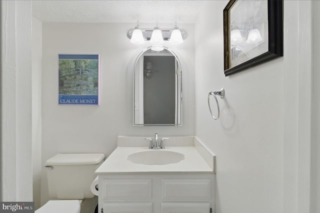 1920 Belmont Ridge Ct, Reston, VA 20191 - bathroom with vanity, toilet, and a textured ceiling