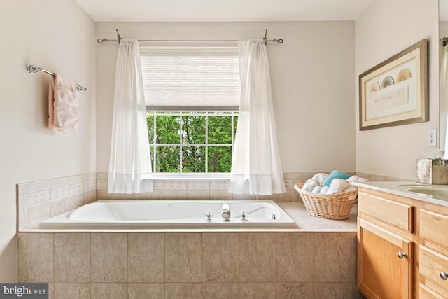 full bath with a bath and vanity