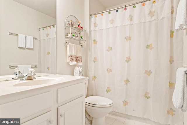 full bath with tile patterned floors, toilet, and vanity