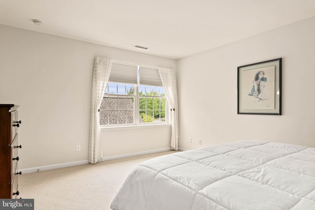 bedroom featuring carpet flooring and baseboards