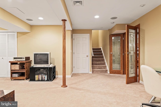 carpeted living area with baseboards, stairs, and recessed lighting