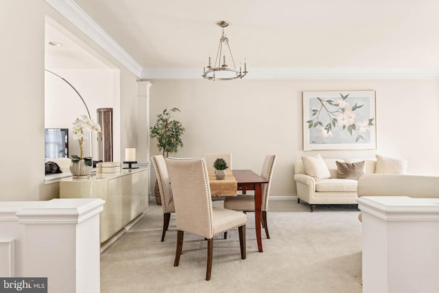 dining area with a chandelier, crown molding, and light carpet