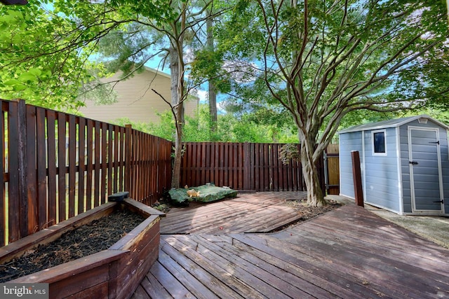 8838 Cross Country Pl, Gaithersburg, MD 20879 - wooden deck featuring a fenced backyard, a storage unit, and an outdoor structure