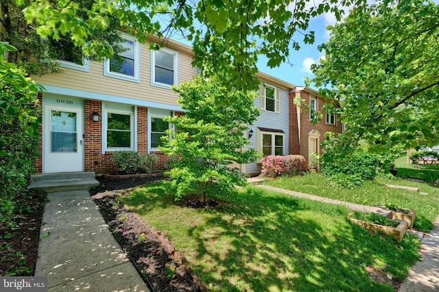 8838 Cross Country Pl, Gaithersburg, MD 20879 - multi unit property with brick siding and a front yard