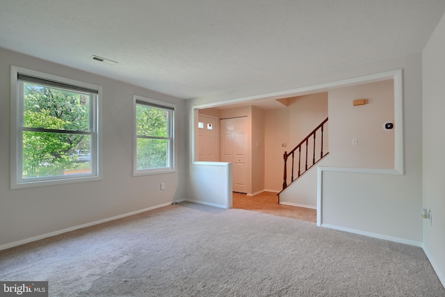 8838 Cross Country Pl, Gaithersburg, MD 20879 - spare room featuring light carpet, stairway, and baseboards