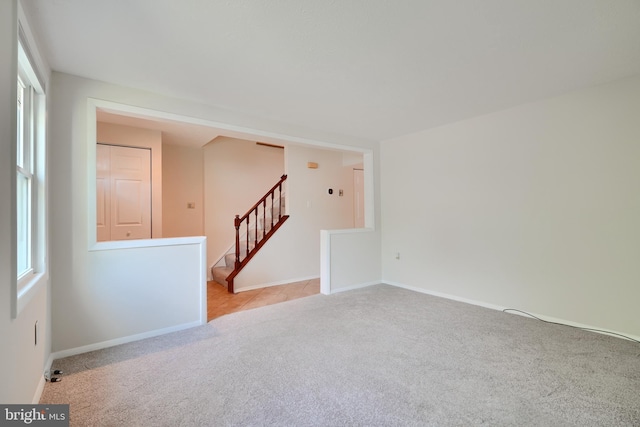 8838 Cross Country Pl, Gaithersburg, MD 20879 - carpeted empty room with stairway and baseboards