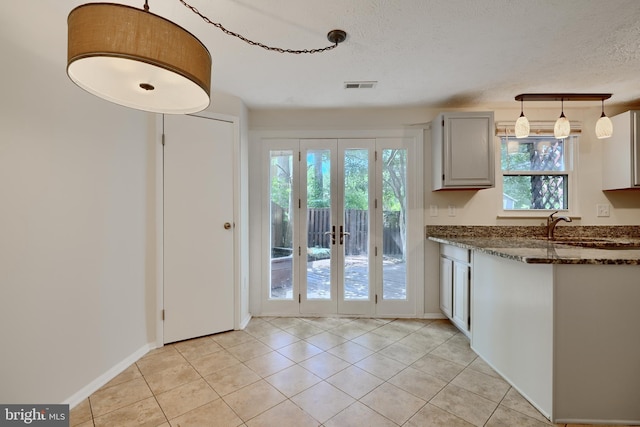 8838 Cross Country Pl, Gaithersburg, MD 20879 - doorway with french doors, light tile patterned floors, a sink, a textured ceiling, and baseboards