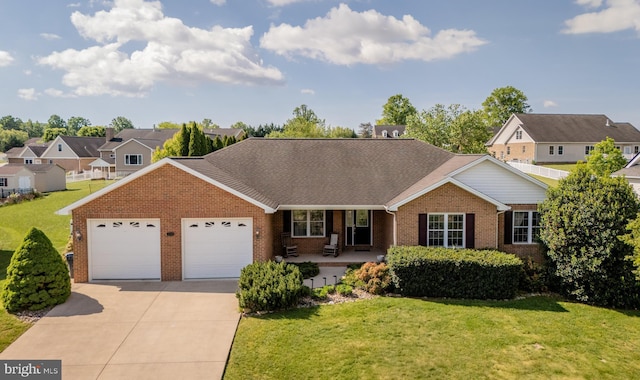 2799 Greenway Ct, Rockingham, VA 22802 - view of front of property featuring brick siding, an attached garage, driveway, a front yard, and covered porch
