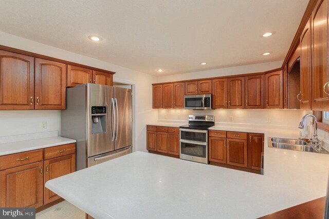 2799 Greenway Ct, Rockingham, VA 22802 - kitchen with appliances with stainless steel finishes, a sink, light countertops, a peninsula, and recessed lighting