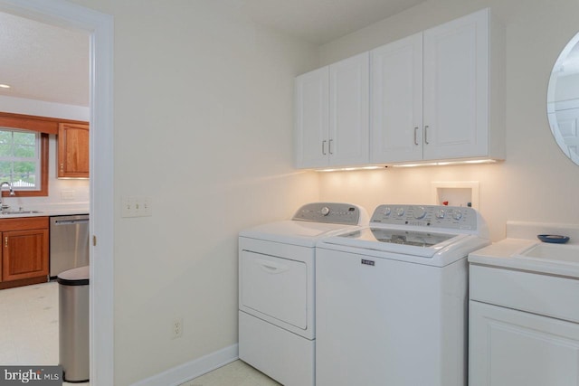 2799 Greenway Ct, Rockingham, VA 22802 - washroom with cabinet space, washing machine and dryer, light flooring, and baseboards