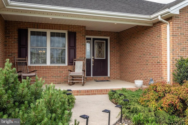 2799 Greenway Ct, Rockingham, VA 22802 - view of exterior entry with a shingled roof and brick siding