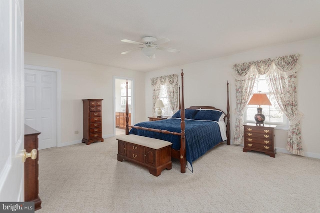 2799 Greenway Ct, Rockingham, VA 22802 - bedroom with light colored carpet, baseboards, a ceiling fan, and connected bathroom