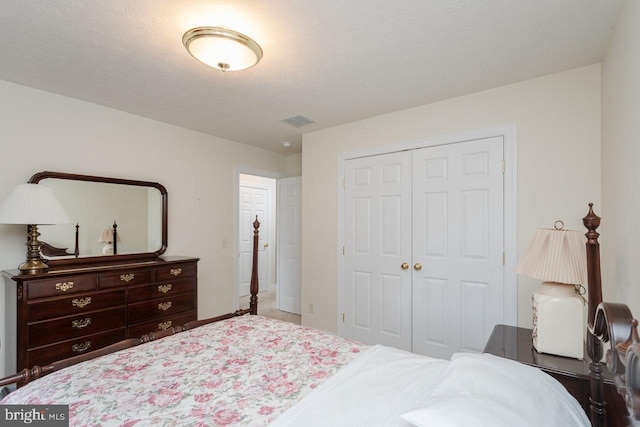 2799 Greenway Ct, Rockingham, VA 22802 - bedroom featuring a closet and a textured ceiling