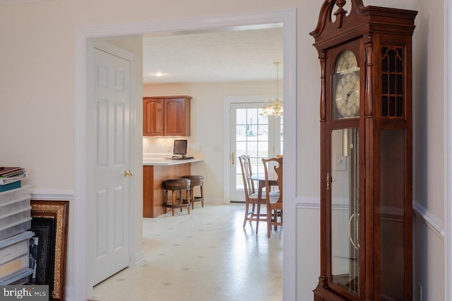 2799 Greenway Ct, Rockingham, VA 22802 - hallway with a chandelier, light flooring, and baseboards
