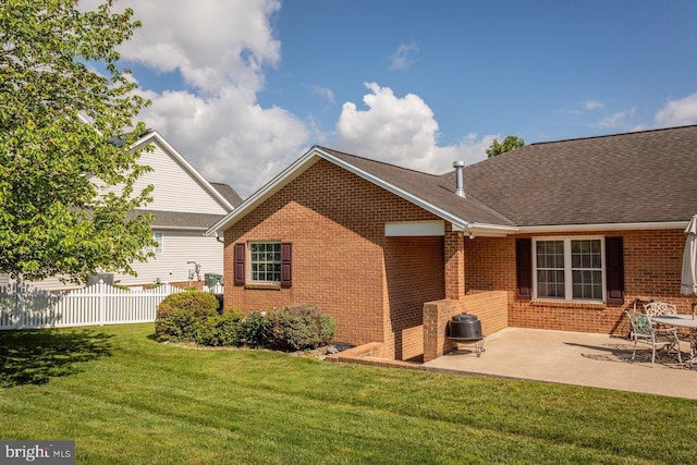2799 Greenway Ct, Rockingham, VA 22802 - back of house featuring brick siding, a patio area, and a shingled roof