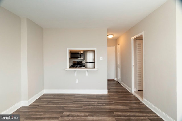 922 24th St NW Unit 806, Washington, DC 20037 - empty room featuring dark wood-style floors and baseboards