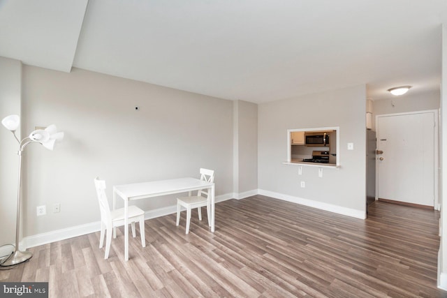 922 24th St NW Unit 806, Washington, DC 20037 - dining area with wood finished floors and baseboards