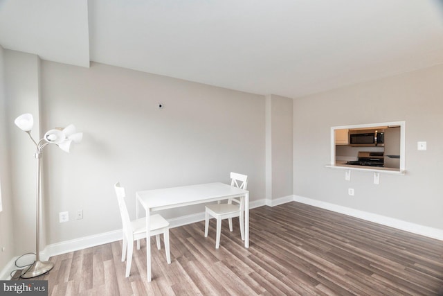 922 24th St NW Unit 806, Washington, DC 20037 - dining space with wood finished floors and baseboards