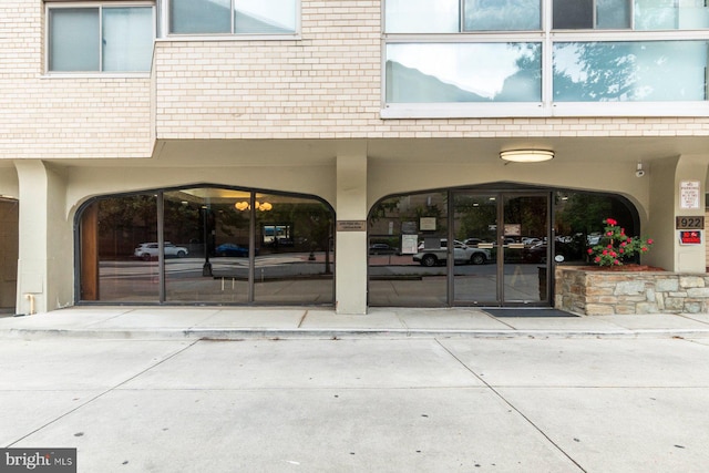 922 24th St NW Unit 806, Washington, DC 20037 - doorway to property with brick siding and a carport