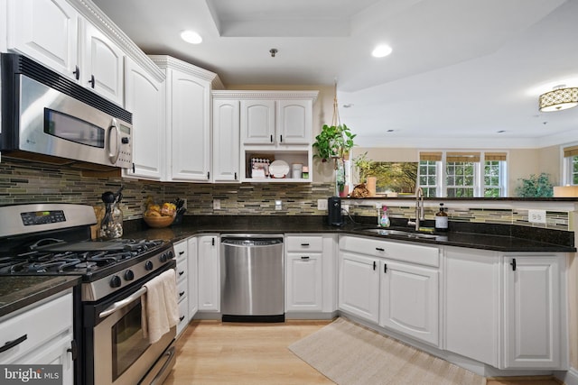 7135 Huntley Creek Pl Unit 55, Alexandria, VA 22306 - kitchen featuring stainless steel appliances, a sink, recessed lighting, backsplash, and white cabinetry