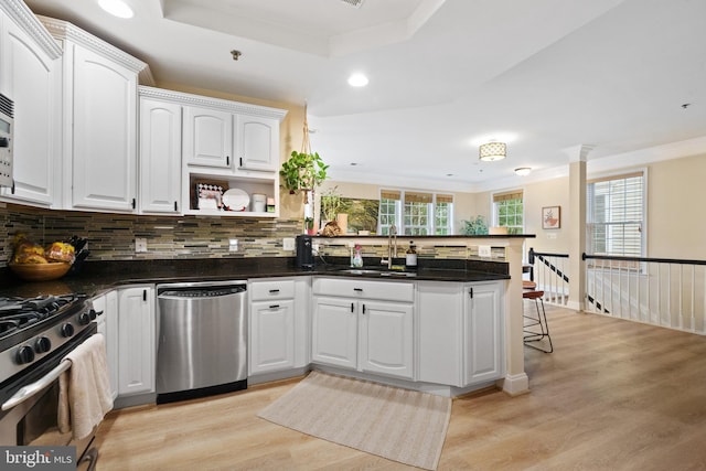 7135 Huntley Creek Pl Unit 55, Alexandria, VA 22306 - kitchen featuring appliances with stainless steel finishes, a sink, a peninsula, light wood-type flooring, and recessed lighting