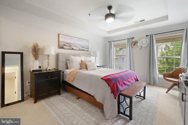 7135 Huntley Creek Pl Unit 55, Alexandria, VA 22306 - bedroom with a tray ceiling, light carpet, and a ceiling fan