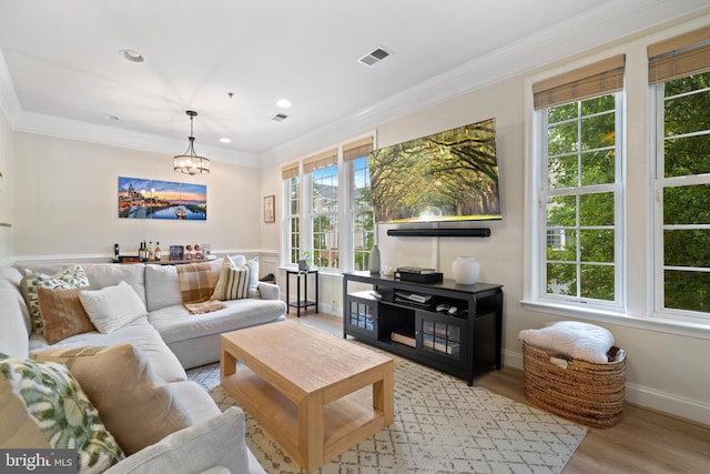 7135 Huntley Creek Pl Unit 55, Alexandria, VA 22306 - living area featuring wood finished floors, ornamental molding, and a chandelier
