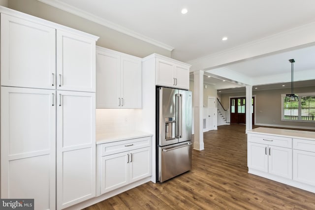 kitchen featuring high quality fridge, crown molding, dark wood-style floors, white cabinets, and recessed lighting