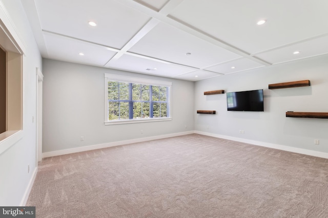 unfurnished living room with coffered ceiling, light carpet, recessed lighting, baseboards, and beamed ceiling