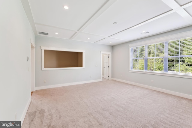 unfurnished room with coffered ceiling, light colored carpet, baseboards, recessed lighting, and beam ceiling