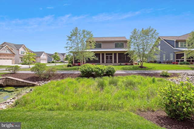 view of front of property featuring a residential view and a sunroom