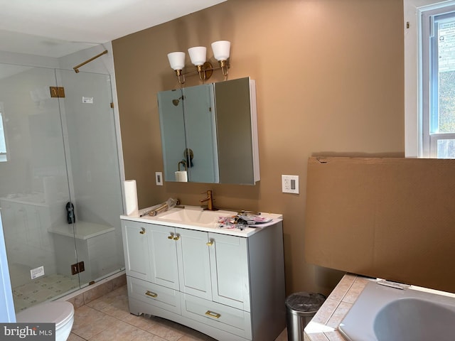 full bathroom with a stall shower, toilet, vanity, tile patterned flooring, and a bath