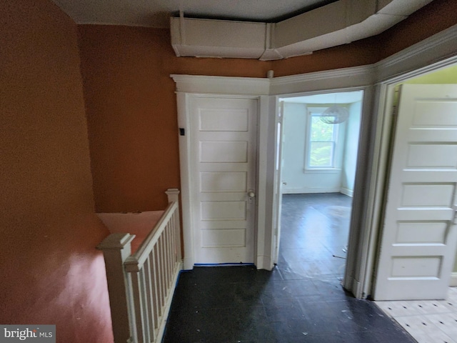 hall featuring an upstairs landing