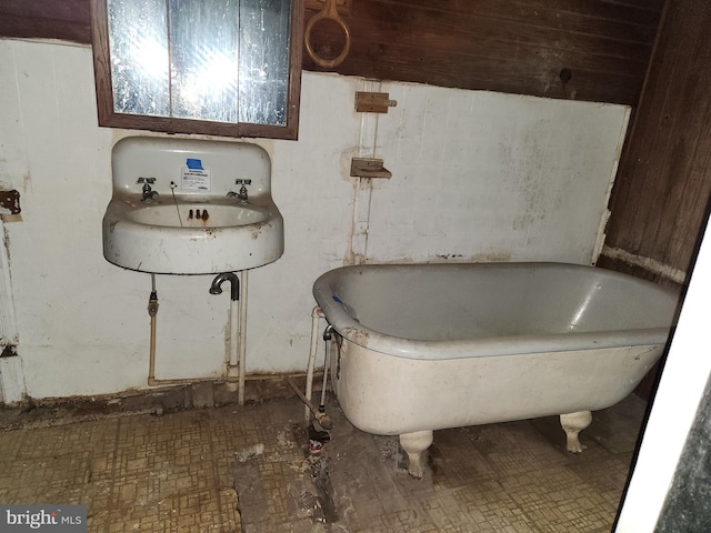 full bath with a freestanding tub
