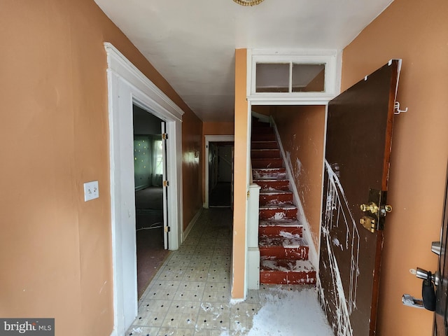 staircase featuring tile patterned floors