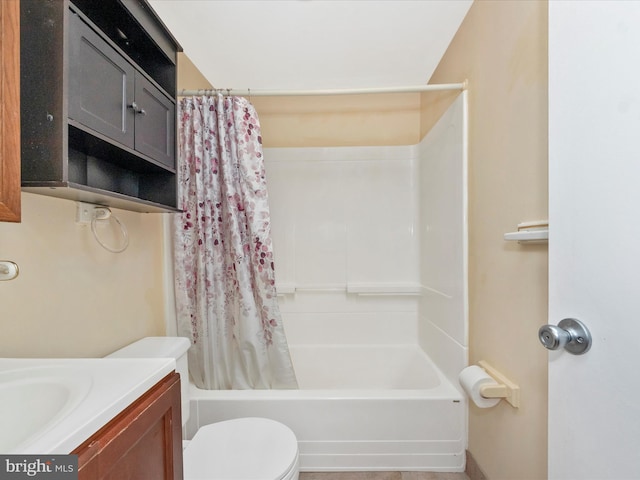 bathroom with toilet, shower / tub combo, and vanity