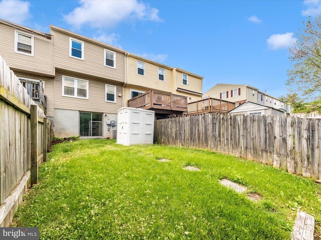 view of yard with a storage shed and an outbuilding
