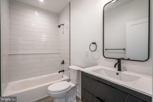 bathroom with toilet, bathing tub / shower combination, and vanity