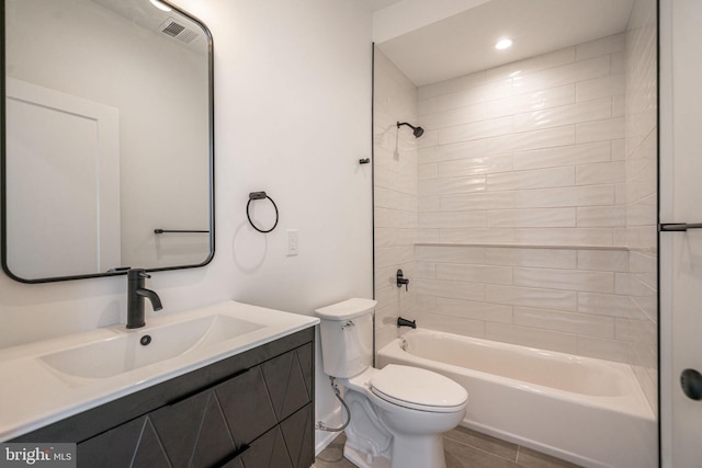 bathroom with toilet, vanity,  shower combination, tile patterned floors, and recessed lighting