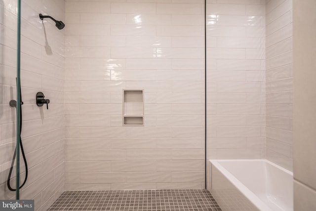 full bathroom with a tile shower