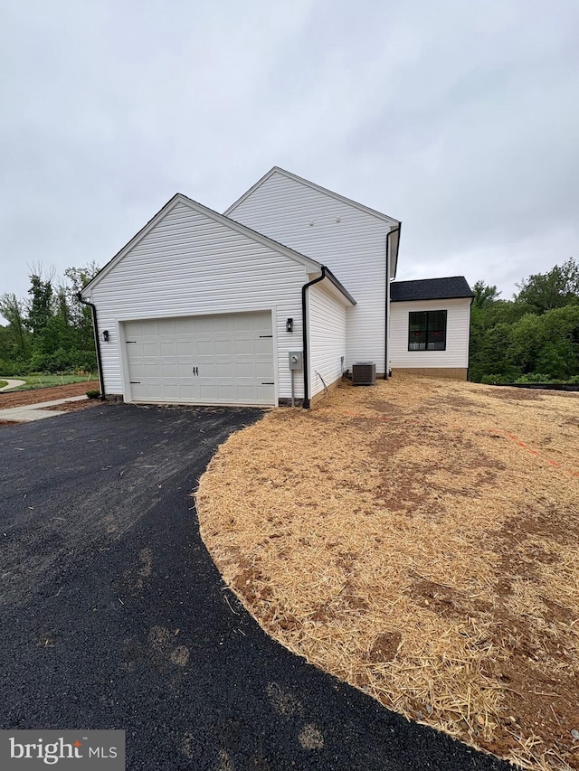 22 Clydesdale Rd, Fredericksburg, VA 22405 - view of property exterior featuring driveway, a garage, and cooling unit