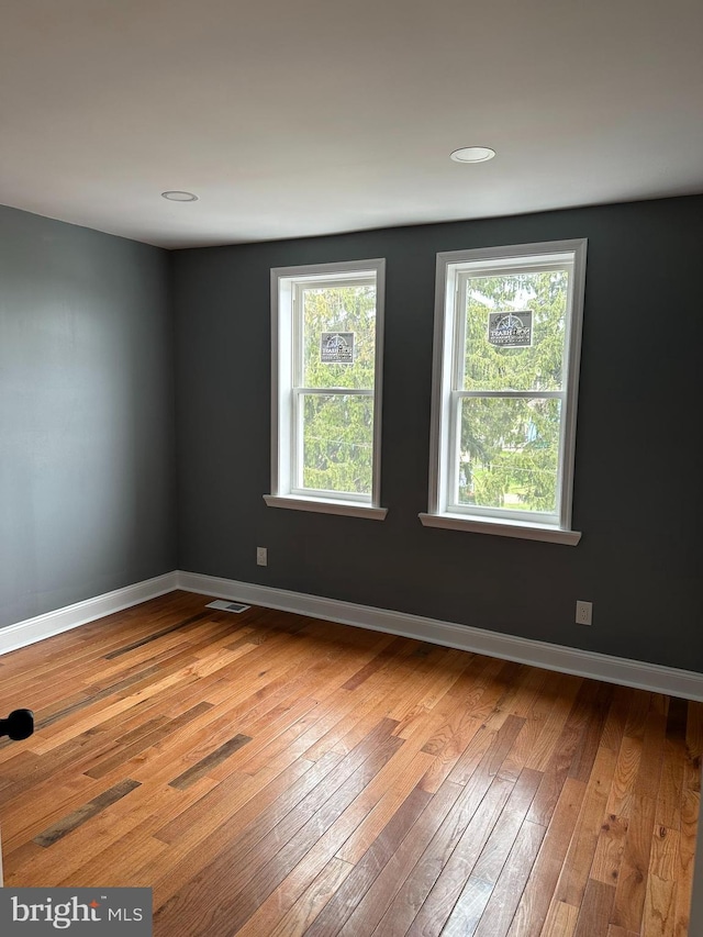 124 E Ruscomb St, Philadelphia, PA 19120 - spare room featuring hardwood / wood-style floors and baseboards